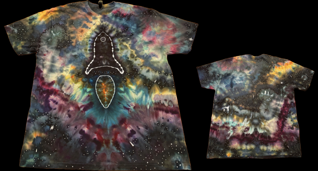 T-shirt with a rocket ship on the front and a galaxy background