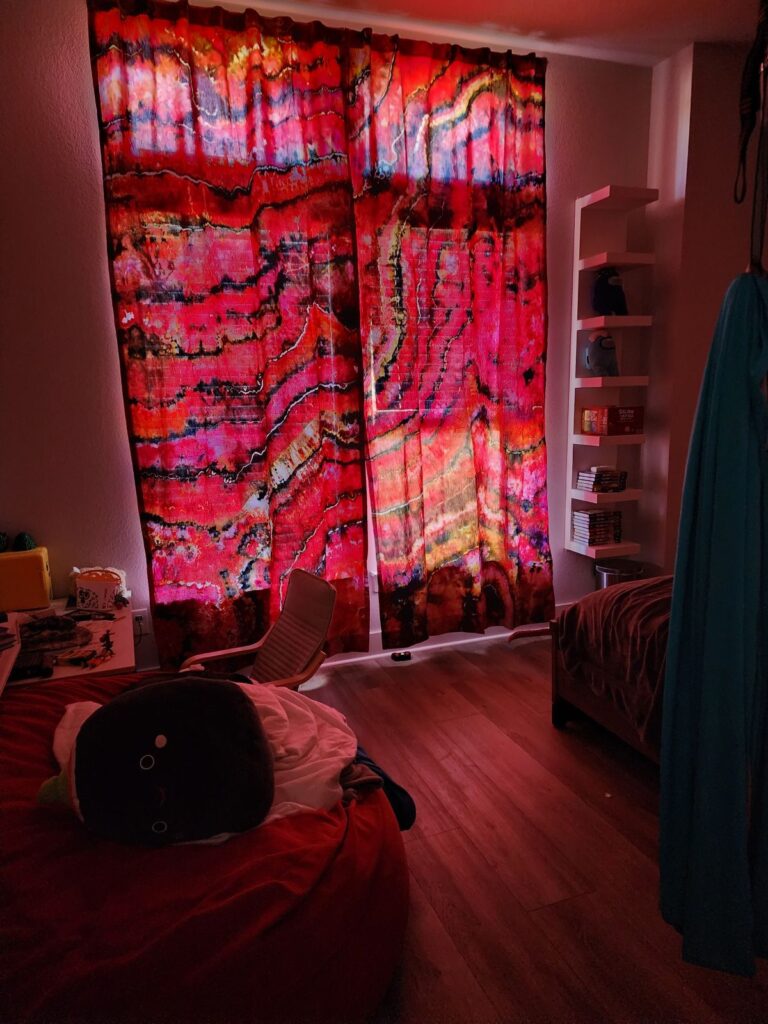 Room with red and black curtains